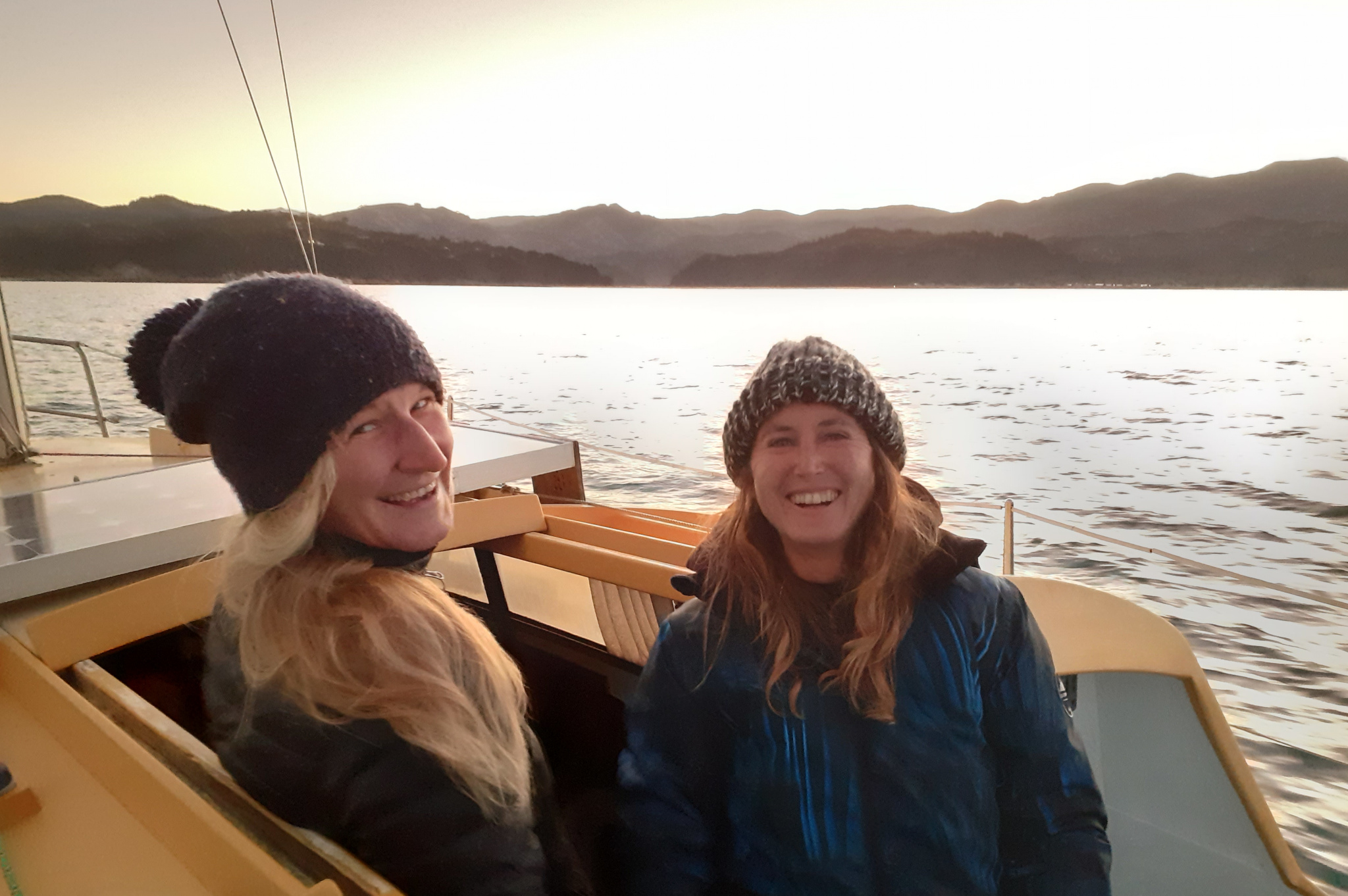 two smiling women out sailing
